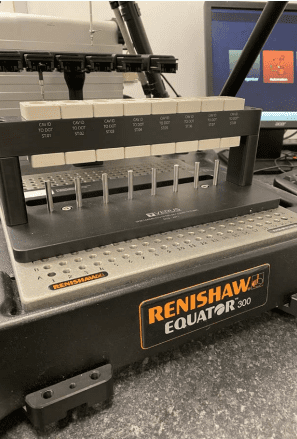 One of Verus' Metrology Inspection Fixtures Holding COVID-19 Test Kits Tubes for Inspection on the Equator 300 Gauging System