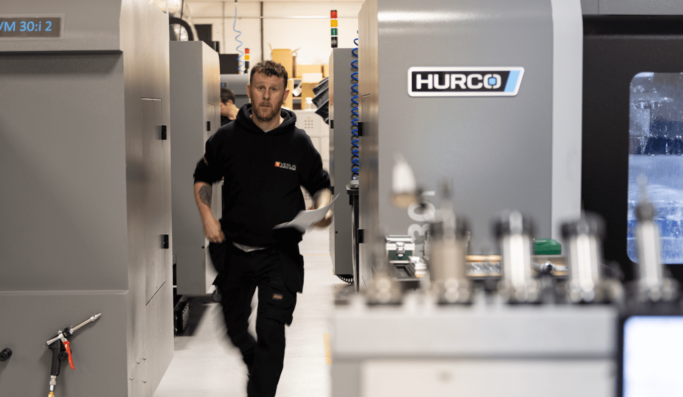 engineer walking through manufacturing floor